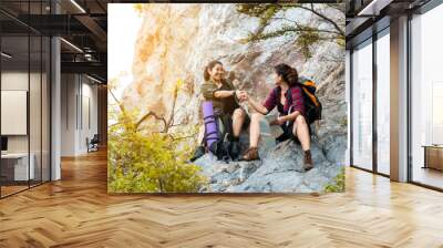 Group woman travel  hiker adventure on mountain nature landscape.  Asia people and friend lifestyle tourist backpack sitting and helping check map to find directions explore and camping outdoors  Wall mural